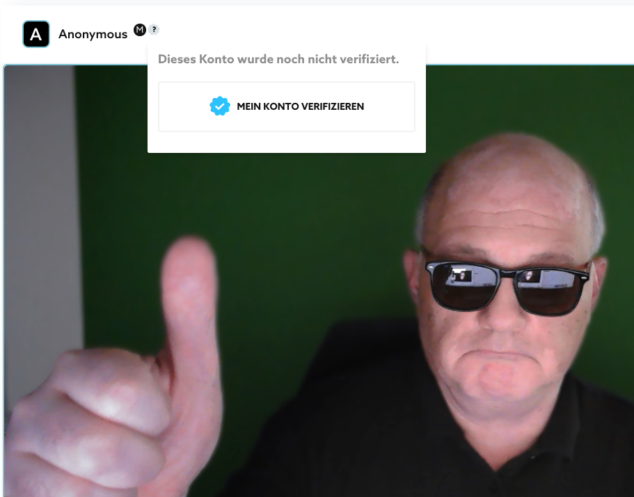 “MEIN KONTO VERIFIZIEREN” rechts vom Videotitel (Maus auf Häkchen zeigt den Dialog).